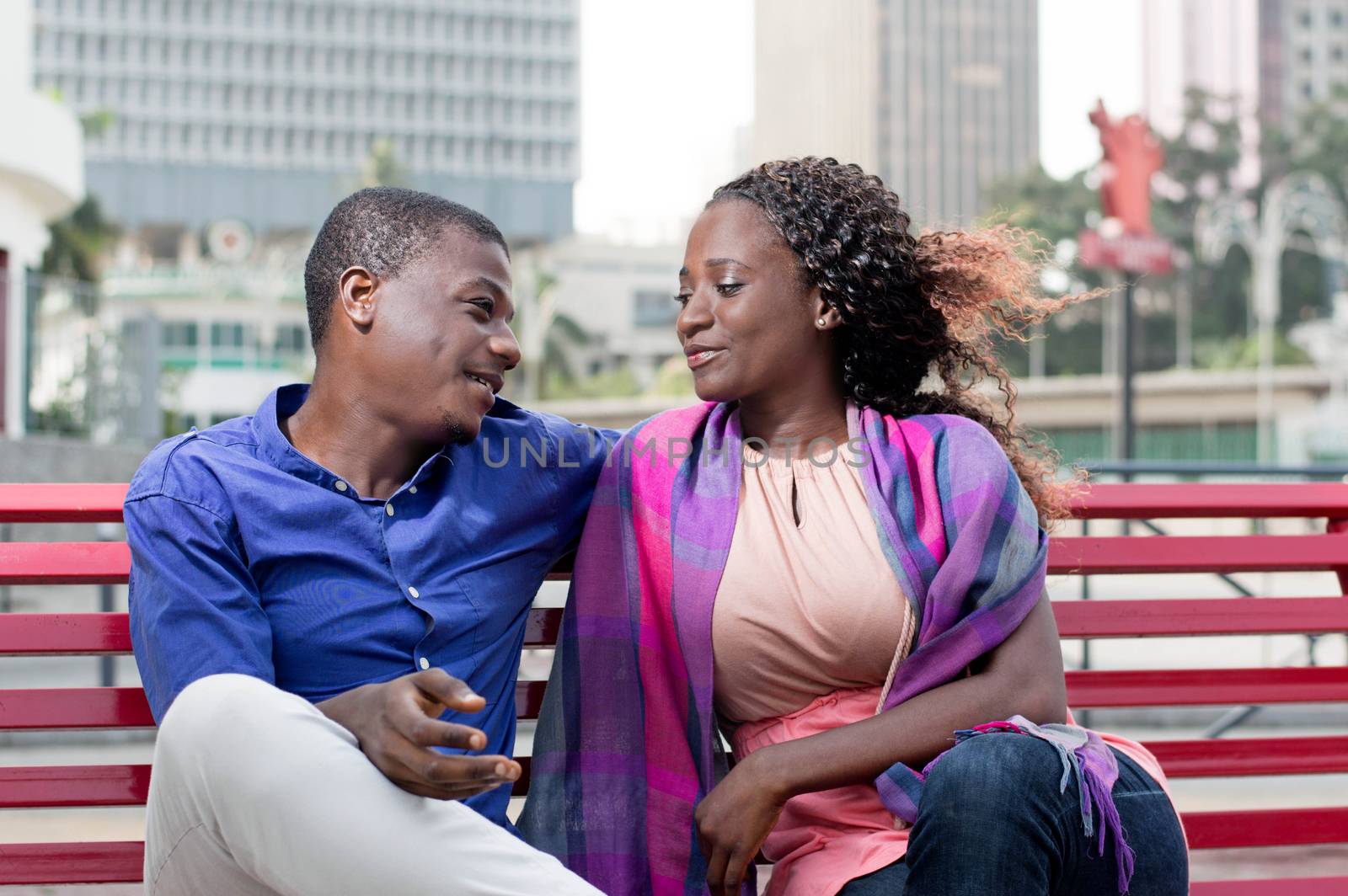 young couple sitting on a bench. by vystek