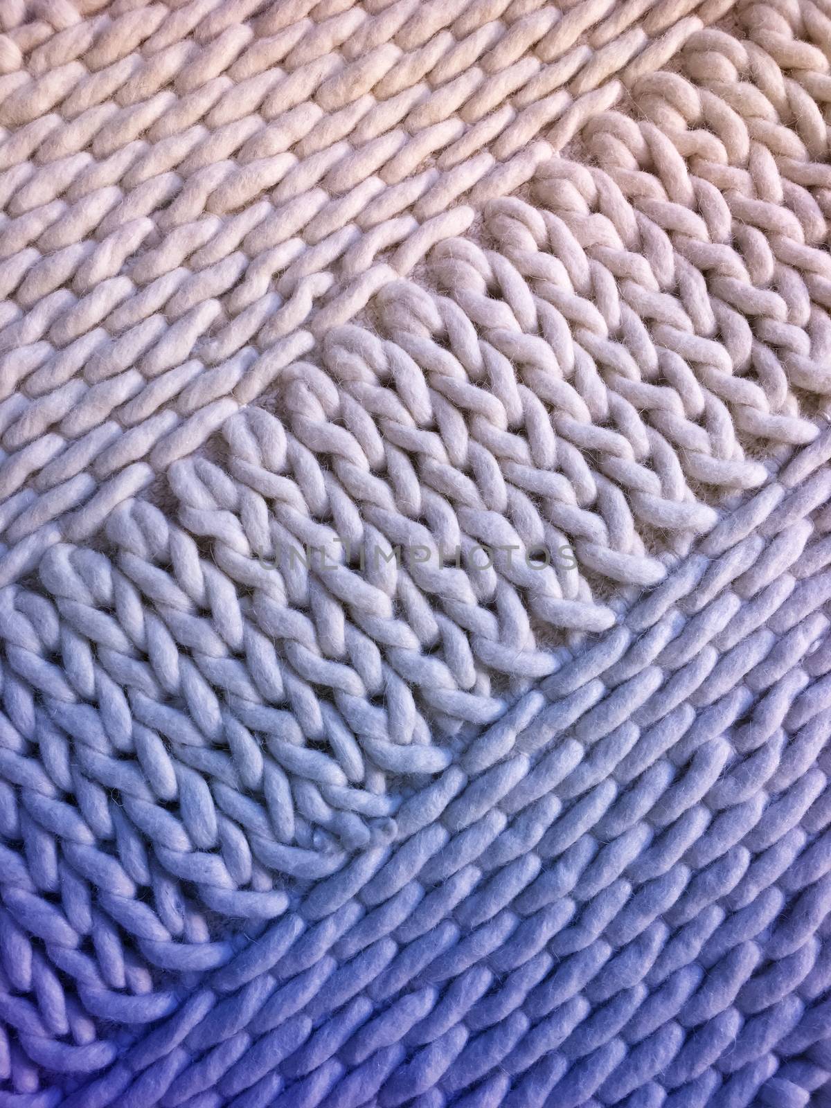 White and blue handmade knitted background with simple design.