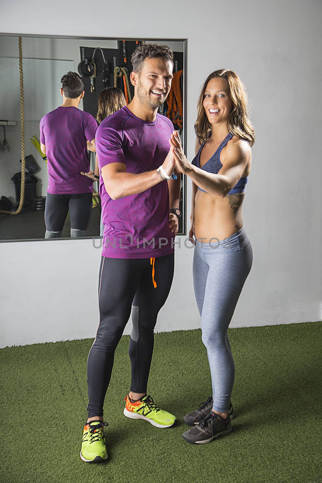 Training couple giving themselve a high five