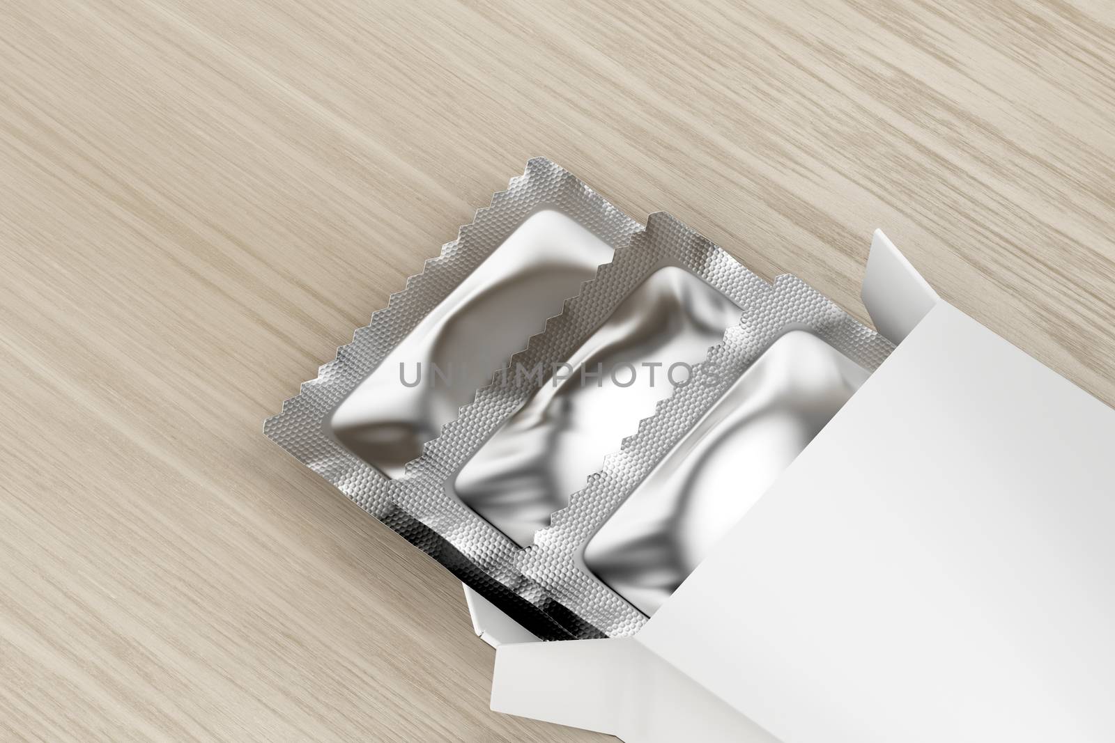 White box with three condoms inside on wooden table