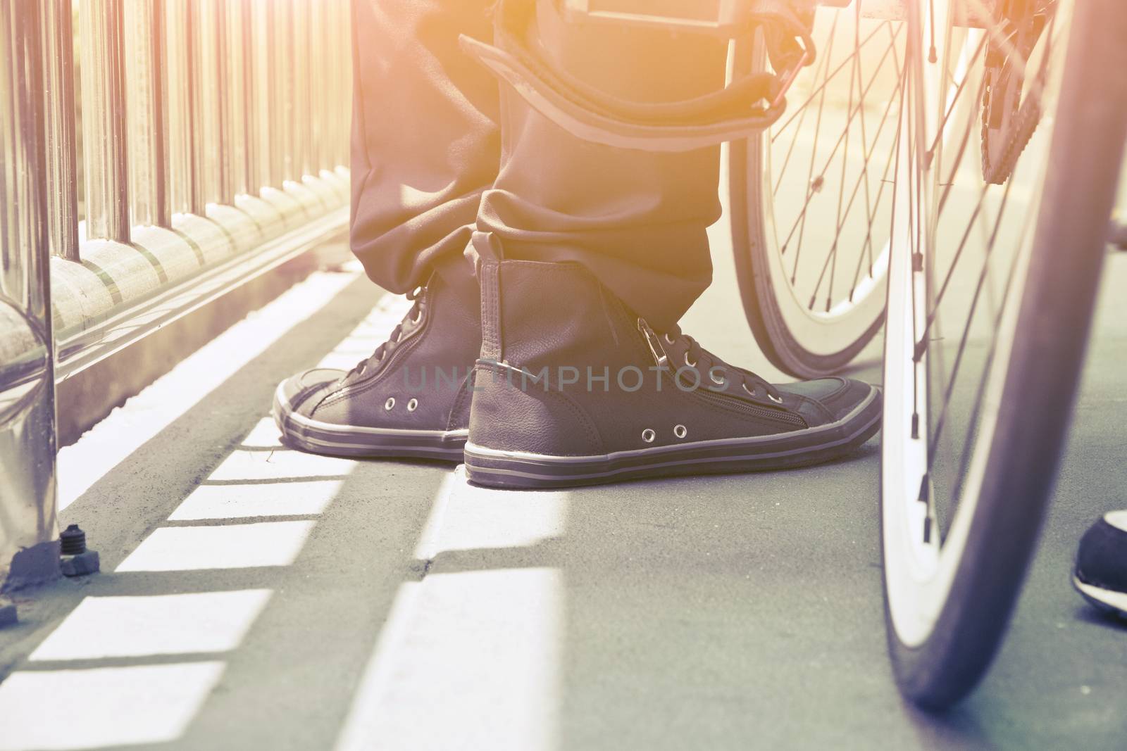 Close-up of man riding his bike in the street