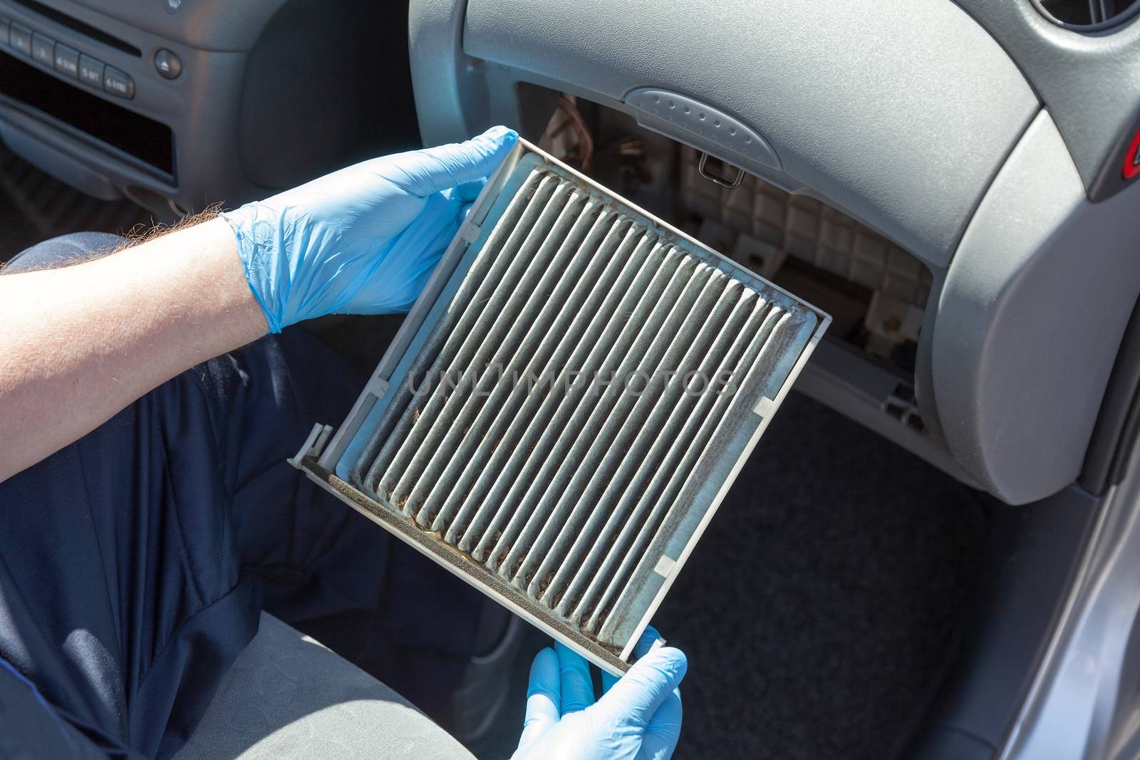 Dirty cabin air filter for car by wellphoto