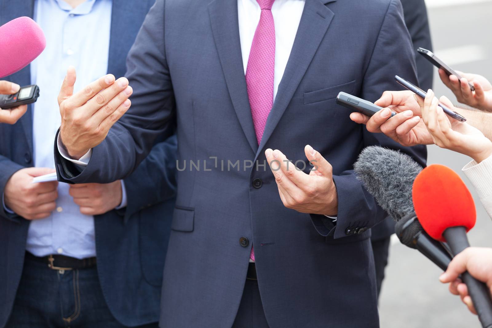 Press interview. Hand gesture. Businessman or politician. by wellphoto