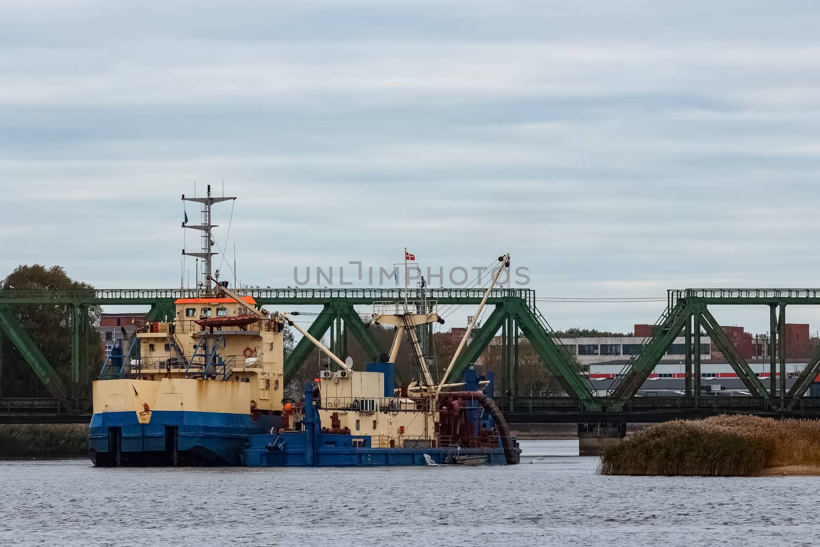 Blue cargo ship in the port of Riga, Europe