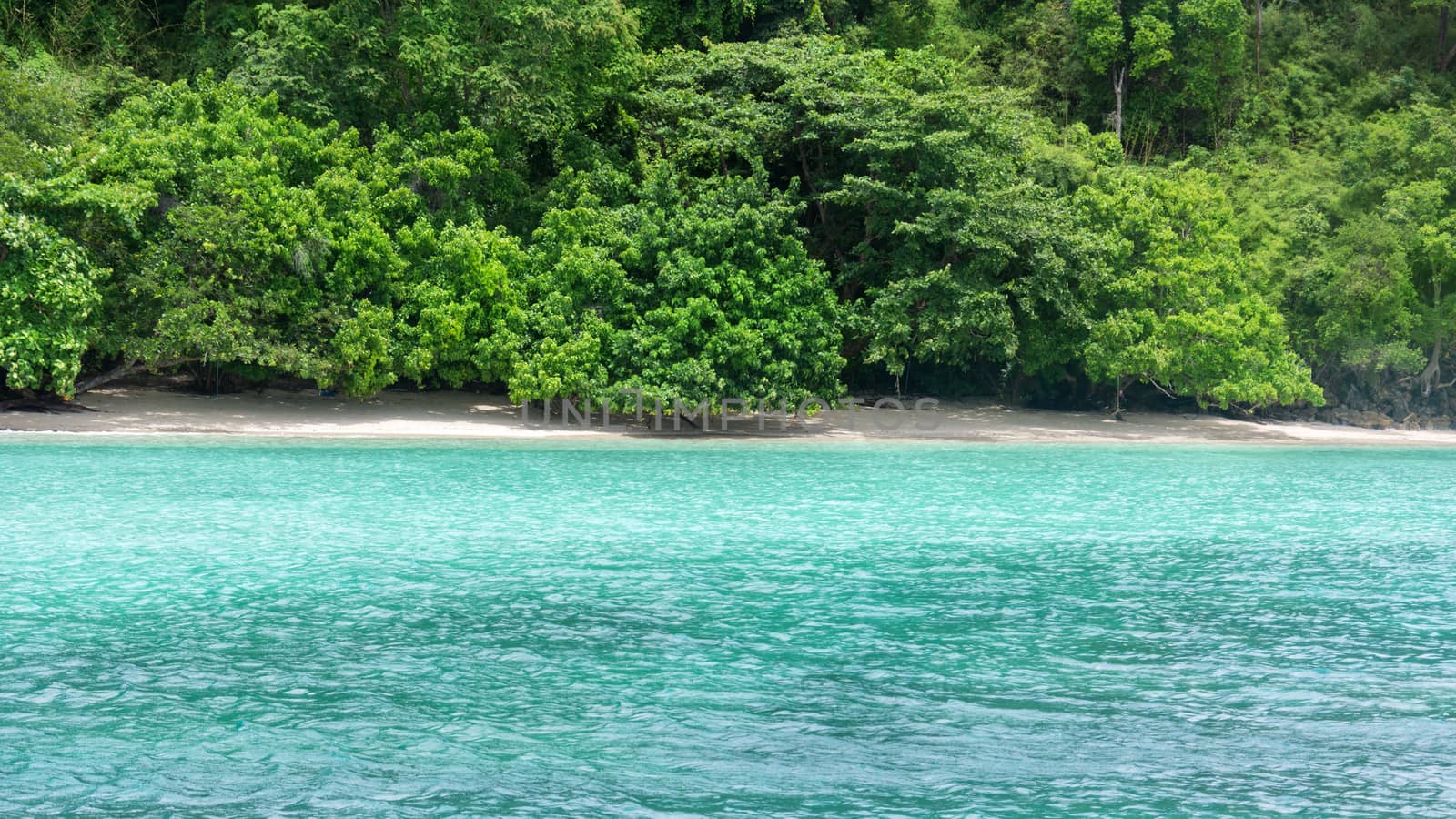 Wave of the sea on the sand beach, Beach and tropical sea, Paradise idyllic beach Krabi, Thailand, Summer holidays, Ocean in the evening as nature travel background.