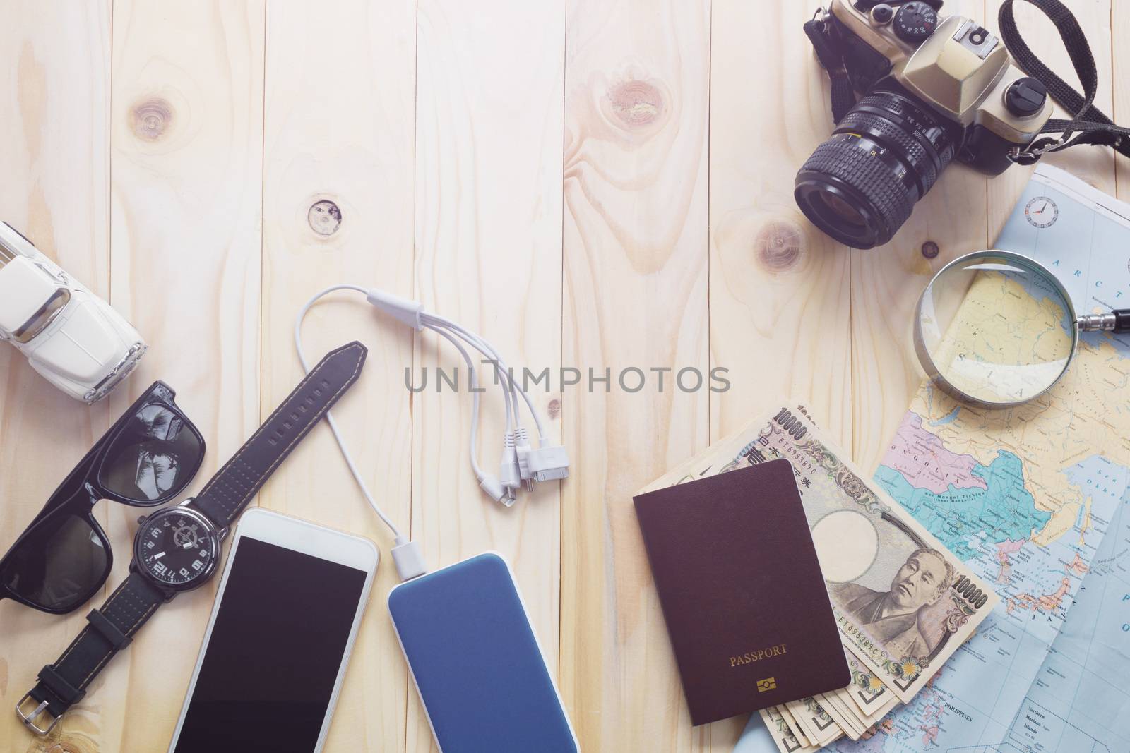 Top View Of Traveler's Accessories Along For The Trip On Wooden Table, Essential Vacation Items, Travel And Vacations Concept For Background