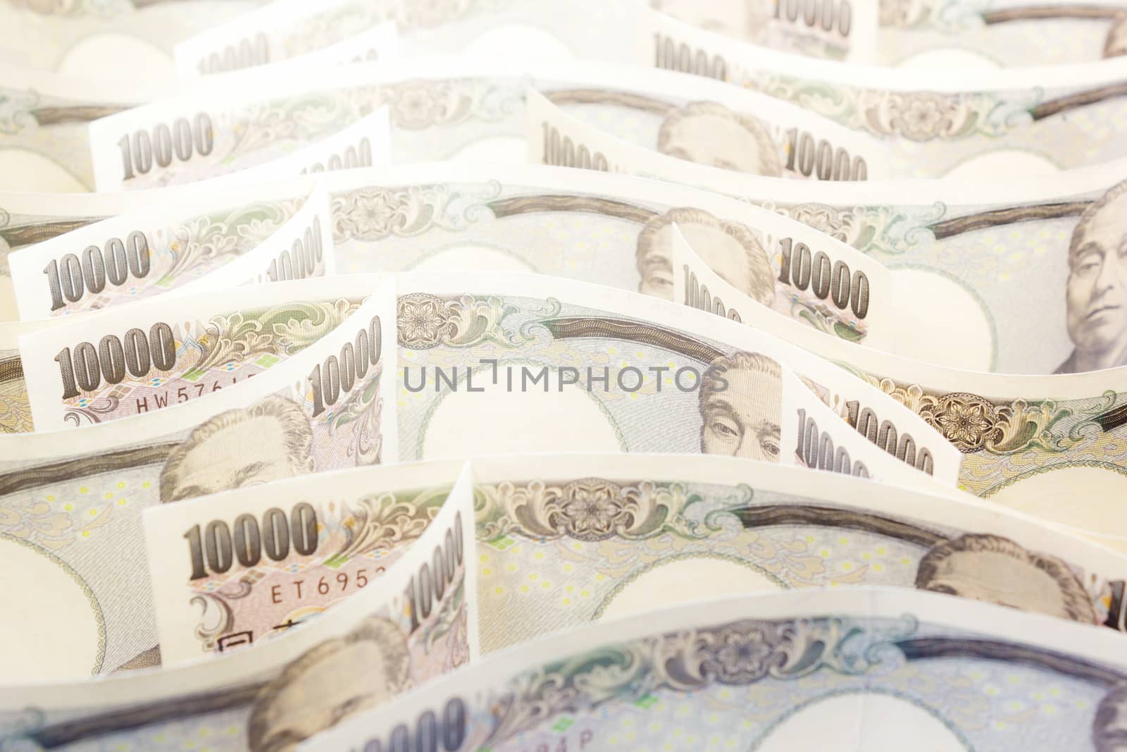 Wave Of Money Yen Banknote On White Background, Business And Fin by rakoptonLPN