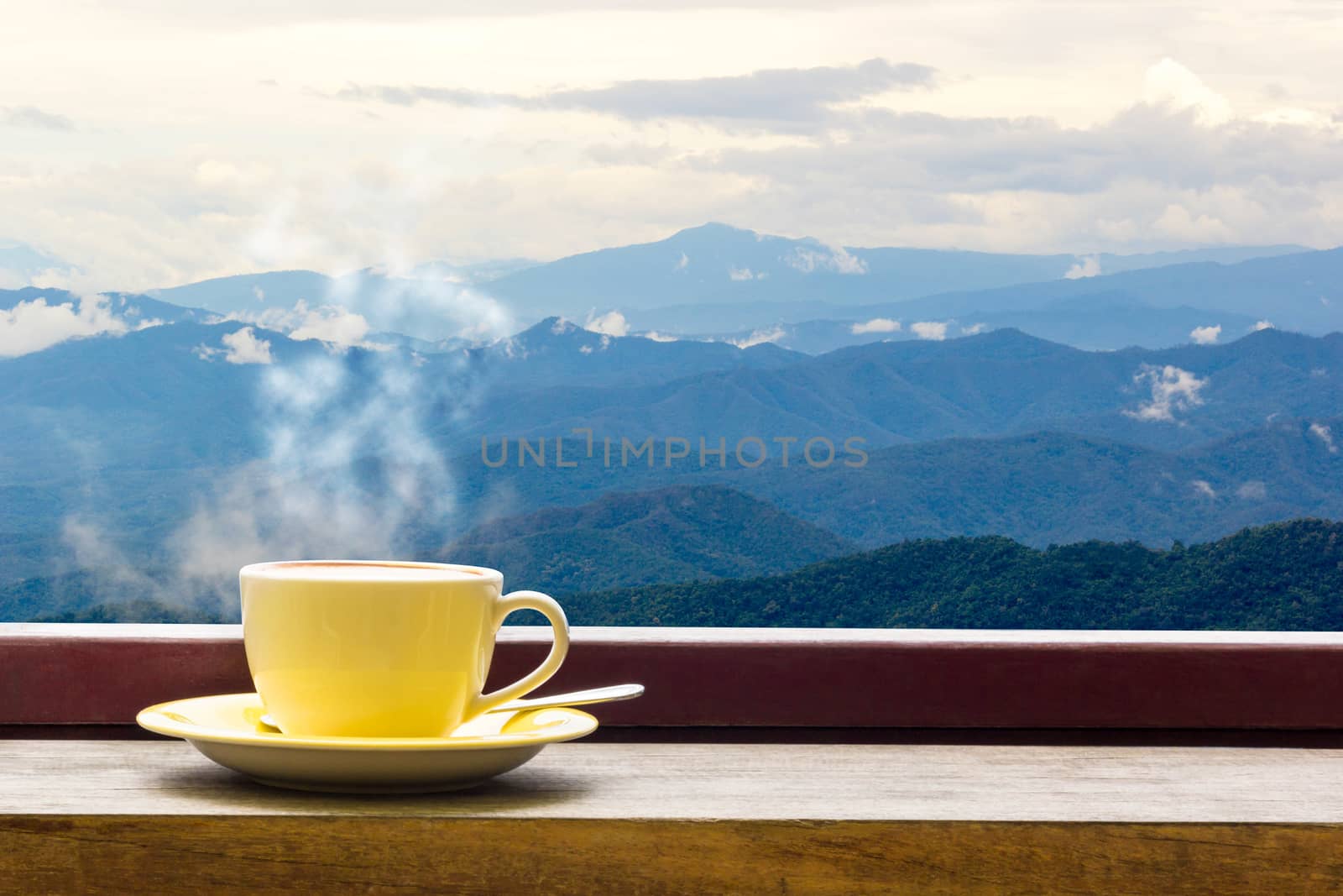 Coffee Mug On Wooden Top Table In Arial View Of Mountian.