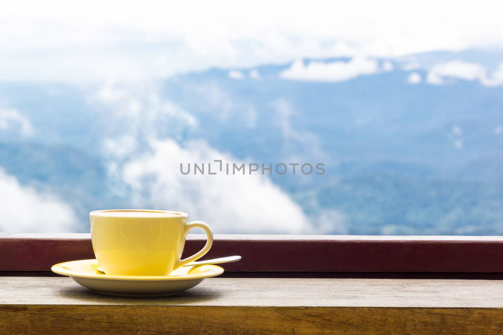 Coffee Mug On Wooden Top Table In Arial View Of Mountian.