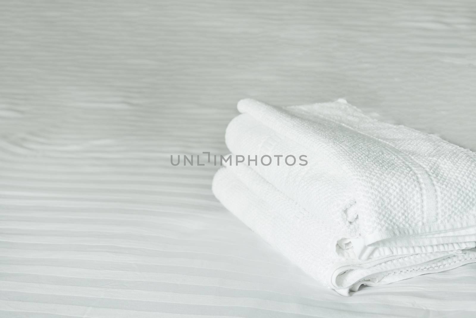 white towel on white mattress fabric, soft light in the morning by rakoptonLPN