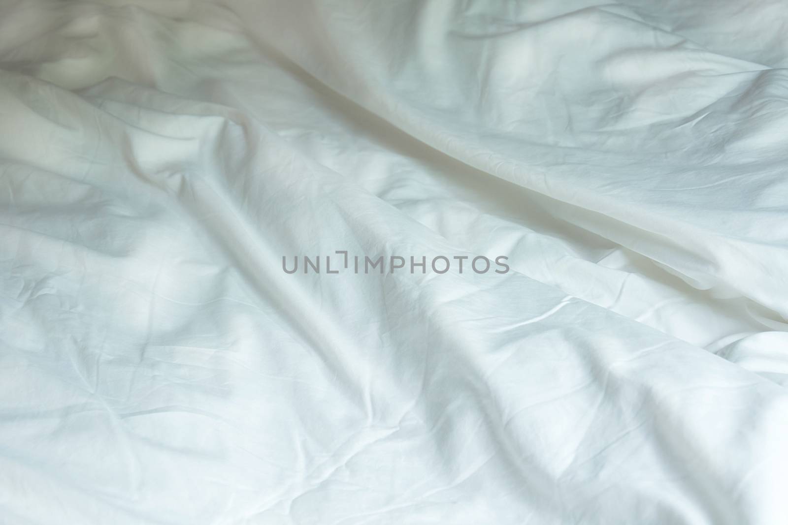 Top View Of White Wrinkle Messy Blanket On Bed, From Sleeping In by rakoptonLPN