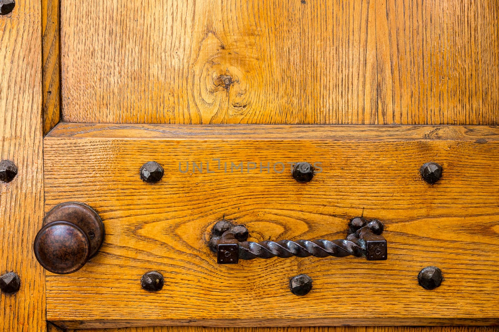 Close up of rustic old door in Spoleto, Italy.