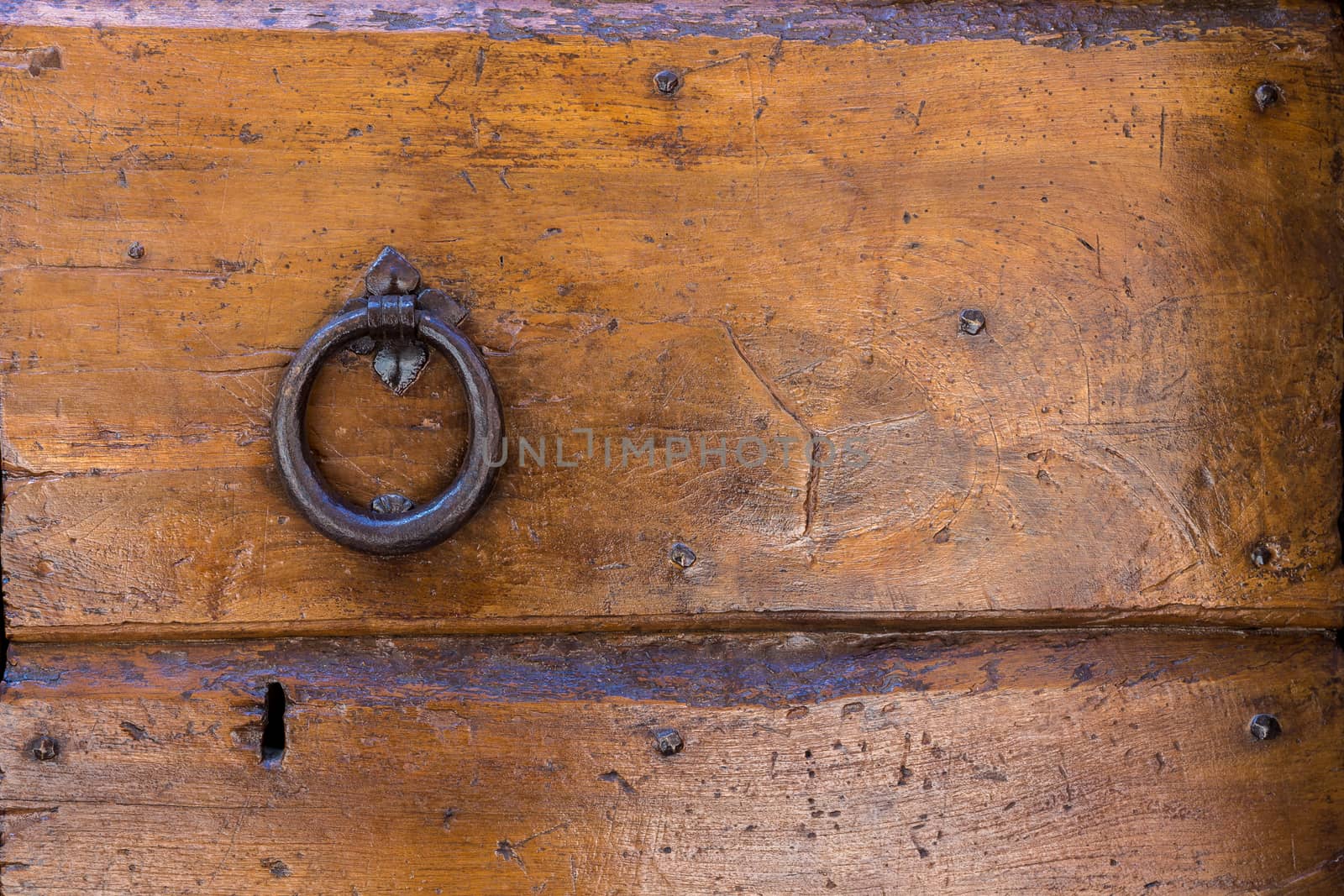 Close up of rustic old door in Spoleto, Italy.