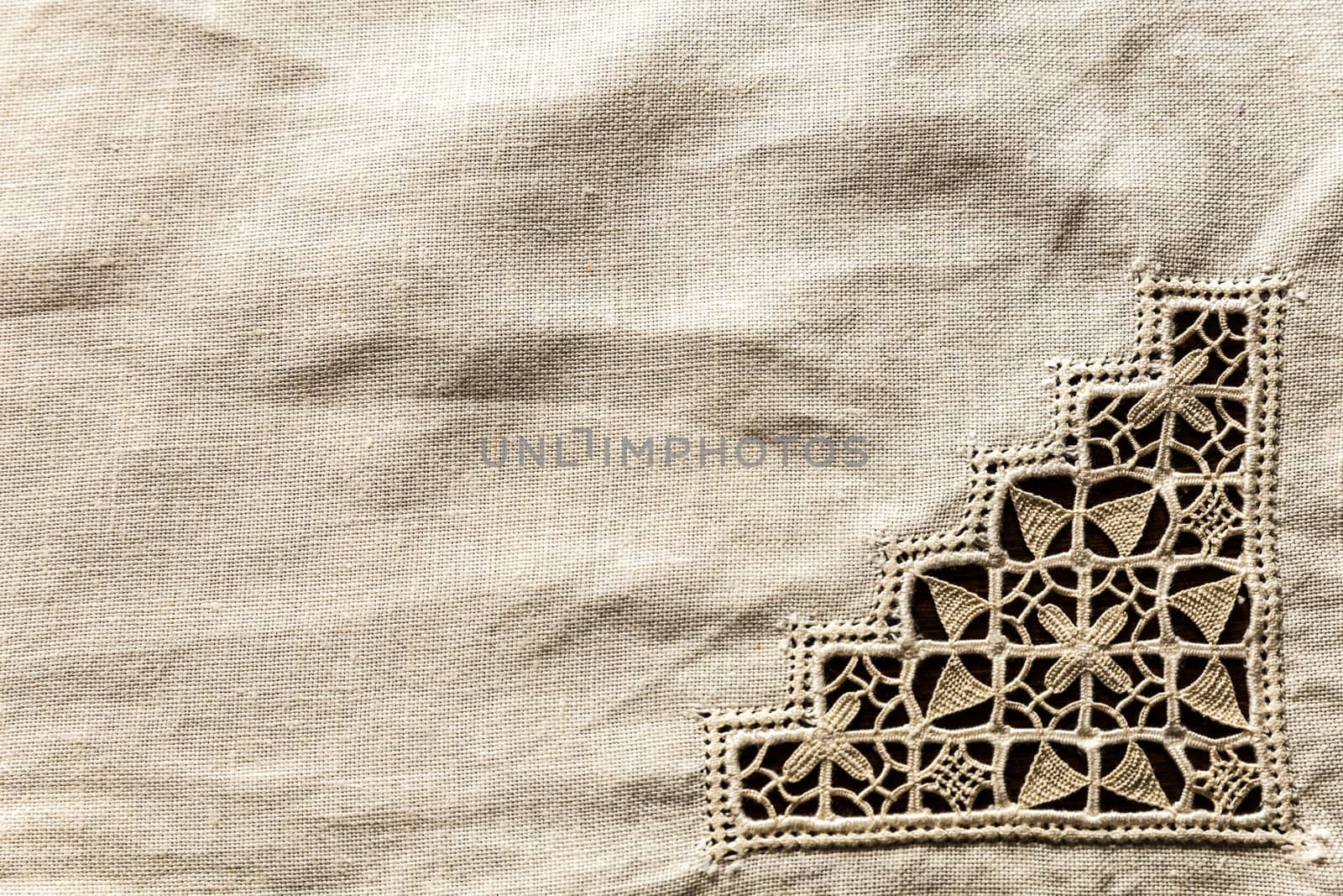 detail of antique handmade embroidered tablecloth
