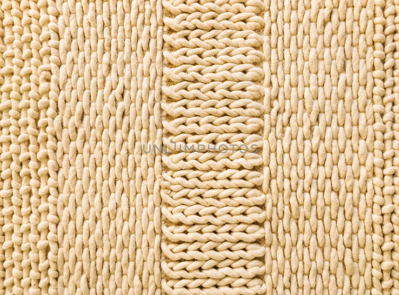 Warm knitted texture with simple ornament. Wool background.