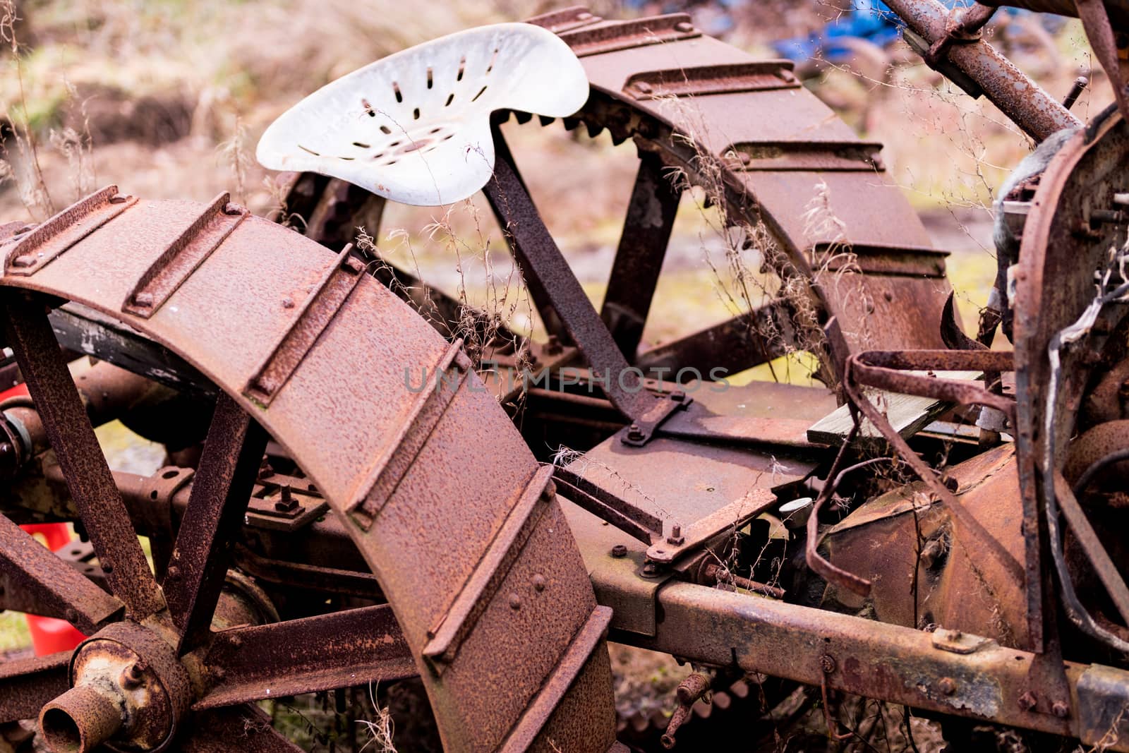 Old rusty tractor cropped by experiencesnw