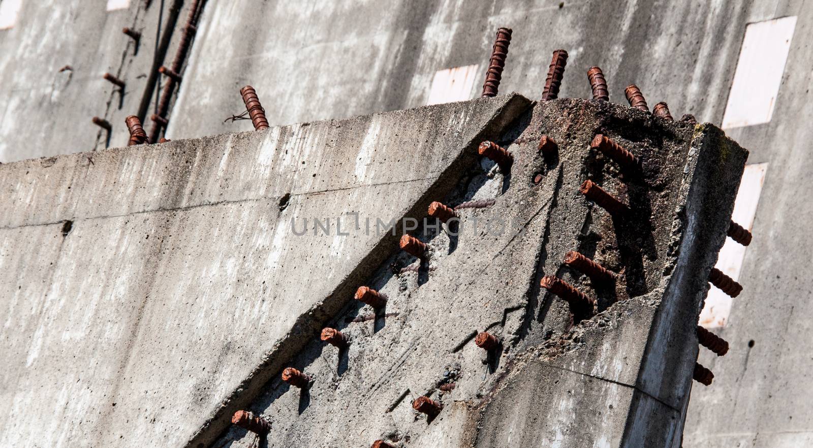 Industrial demolition concrete with rusty rebar by experiencesnw