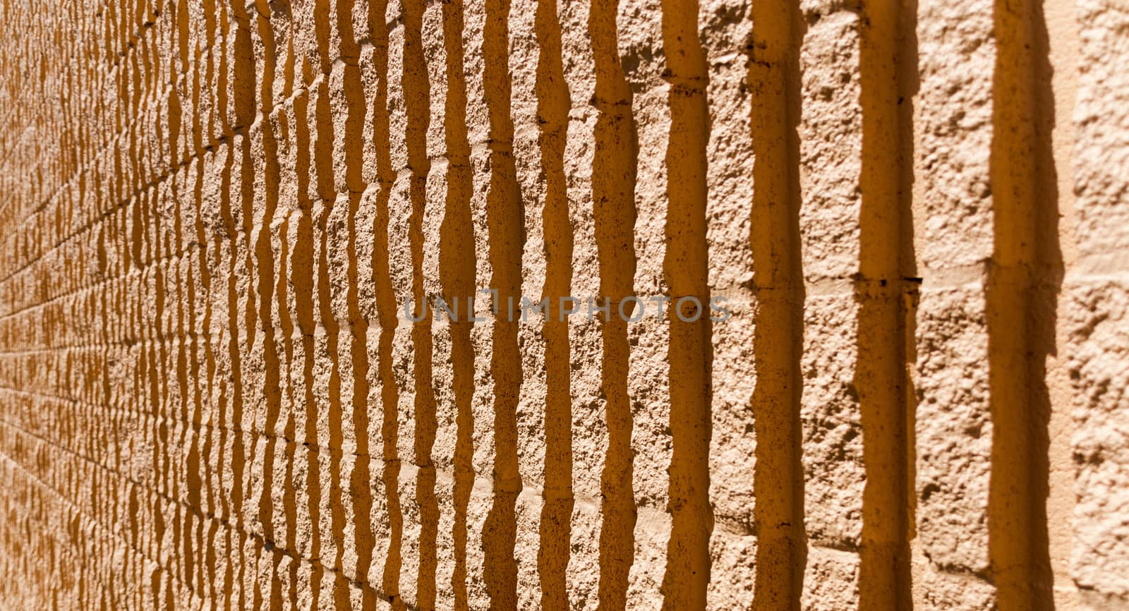 Orange stone wall background fading in the distance