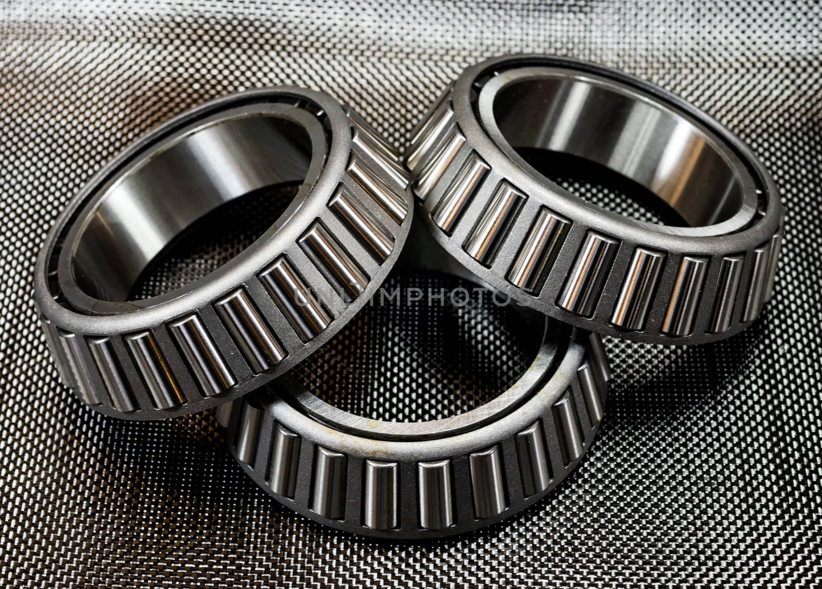 3 automotive tapered roller bearings on carbon fiber. by experiencesnw