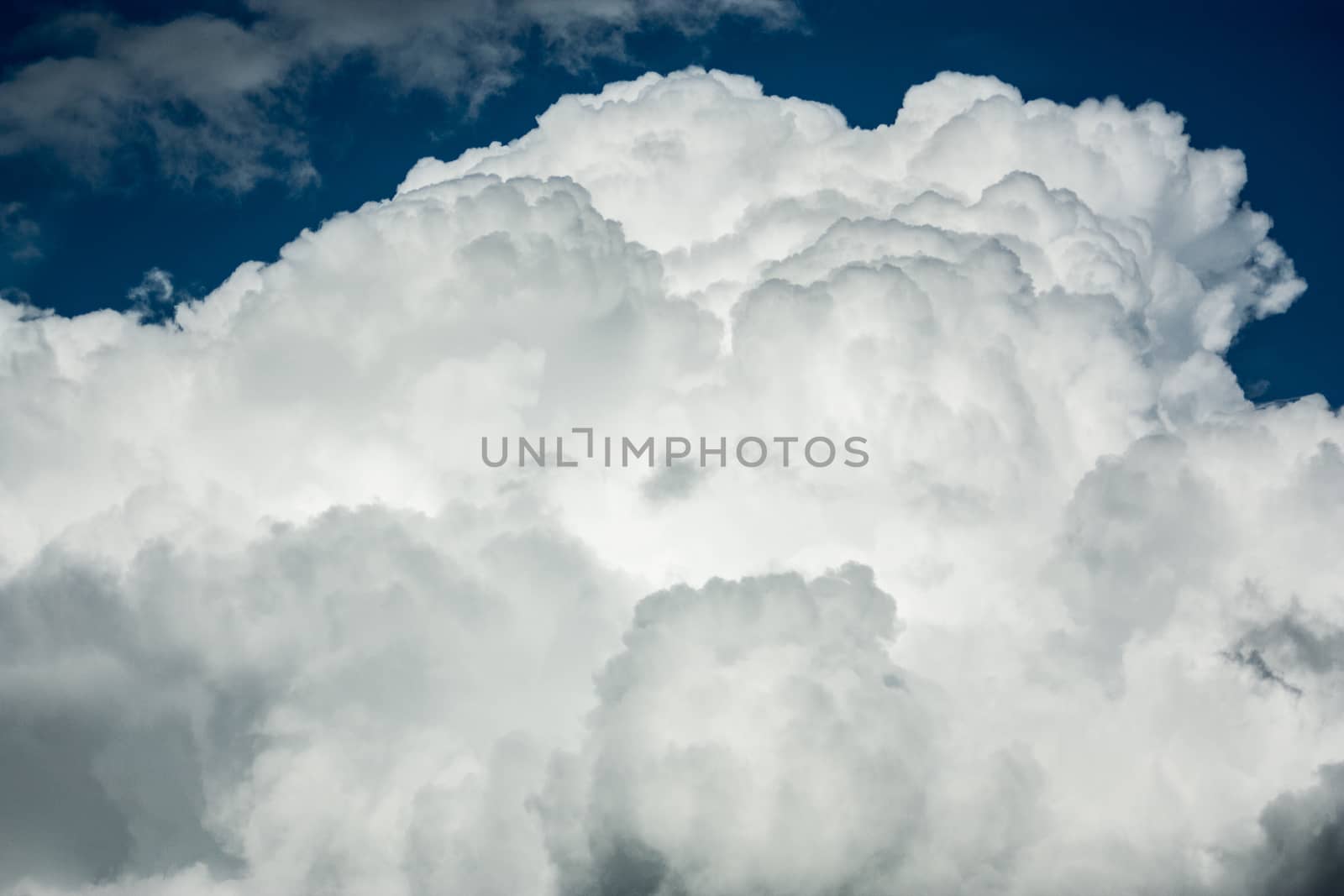 Stratocumulus fluffy cloud formation with blue sky on the top