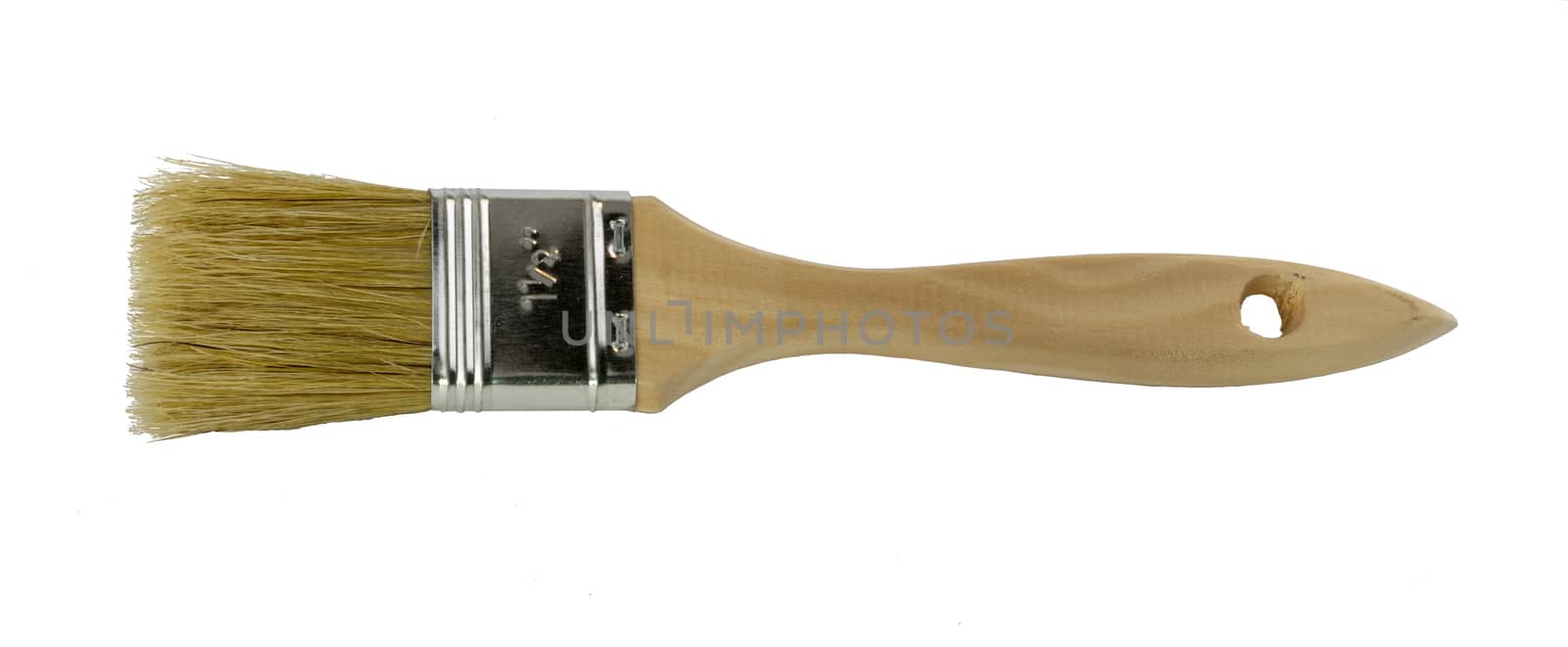 Wooden handled paint brush lying on the side