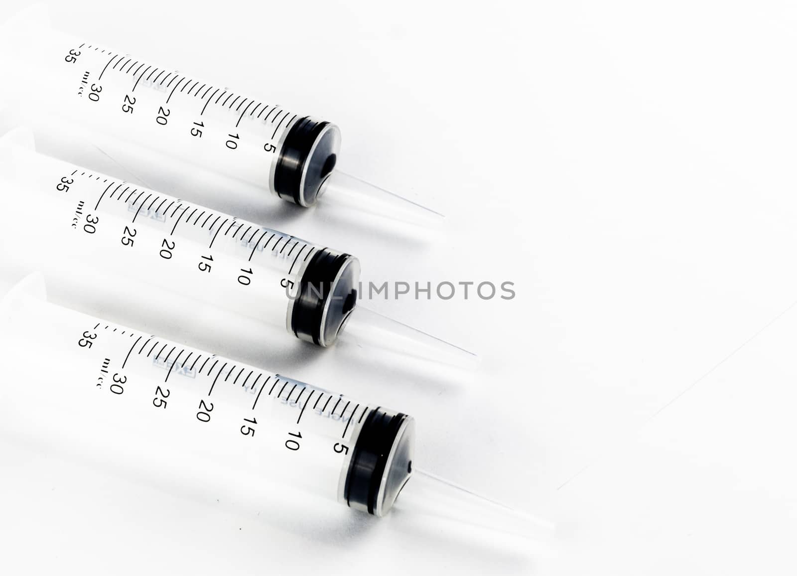 Industrial tapered tip syringes in a row by experiencesnw