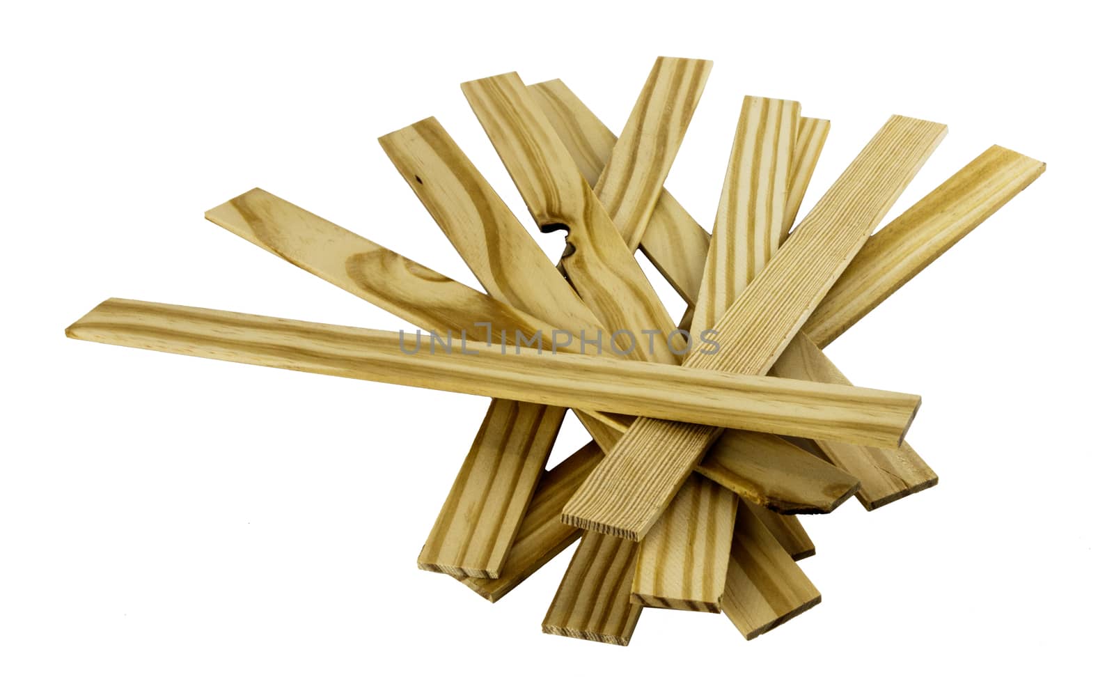 Pile of wooden paint stir sticks on a white background