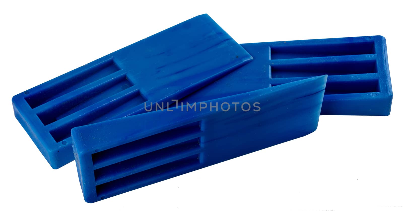 Blue plastic molding wedges stacked by experiencesnw