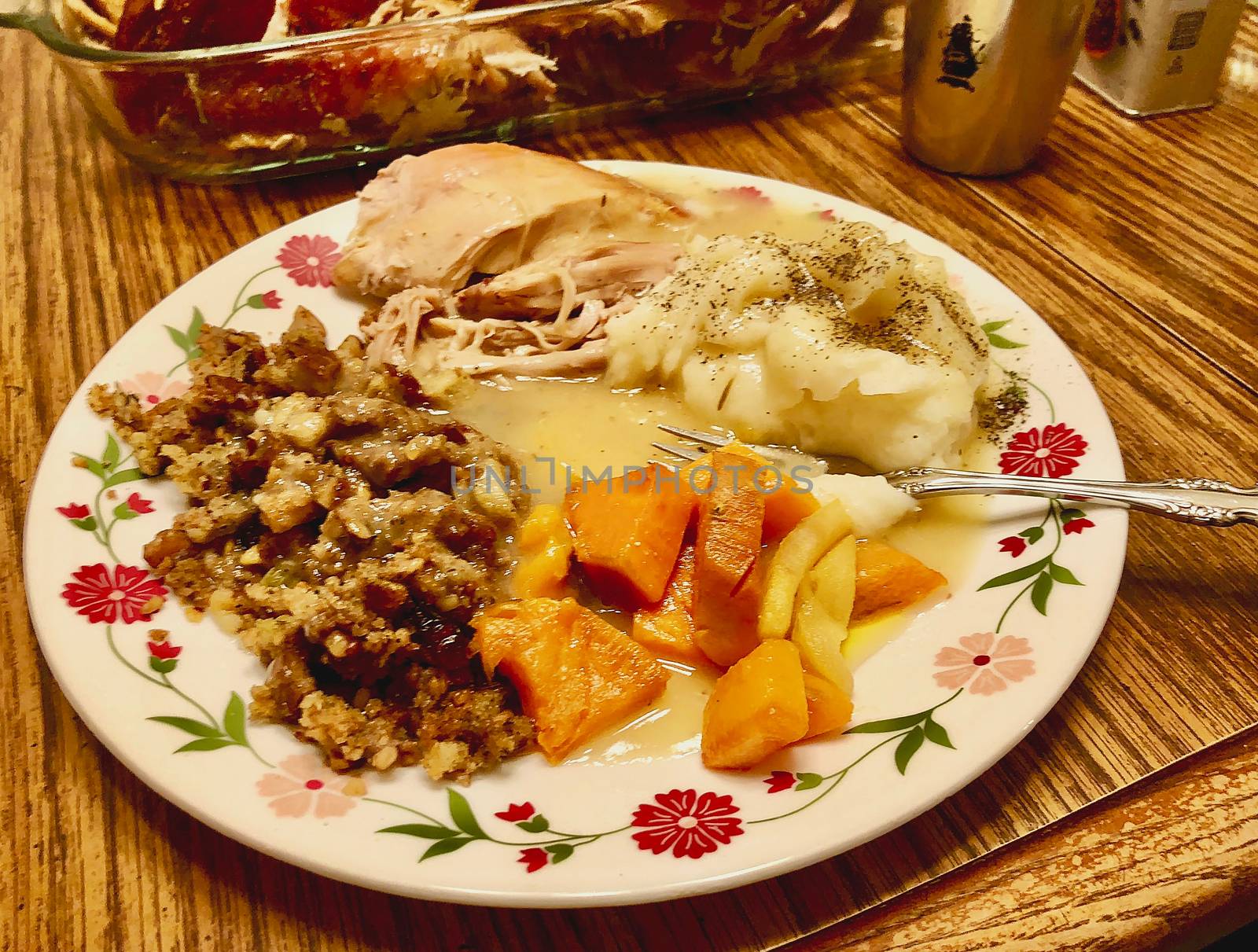 A plate of Thanksgiving food appears in closeup.