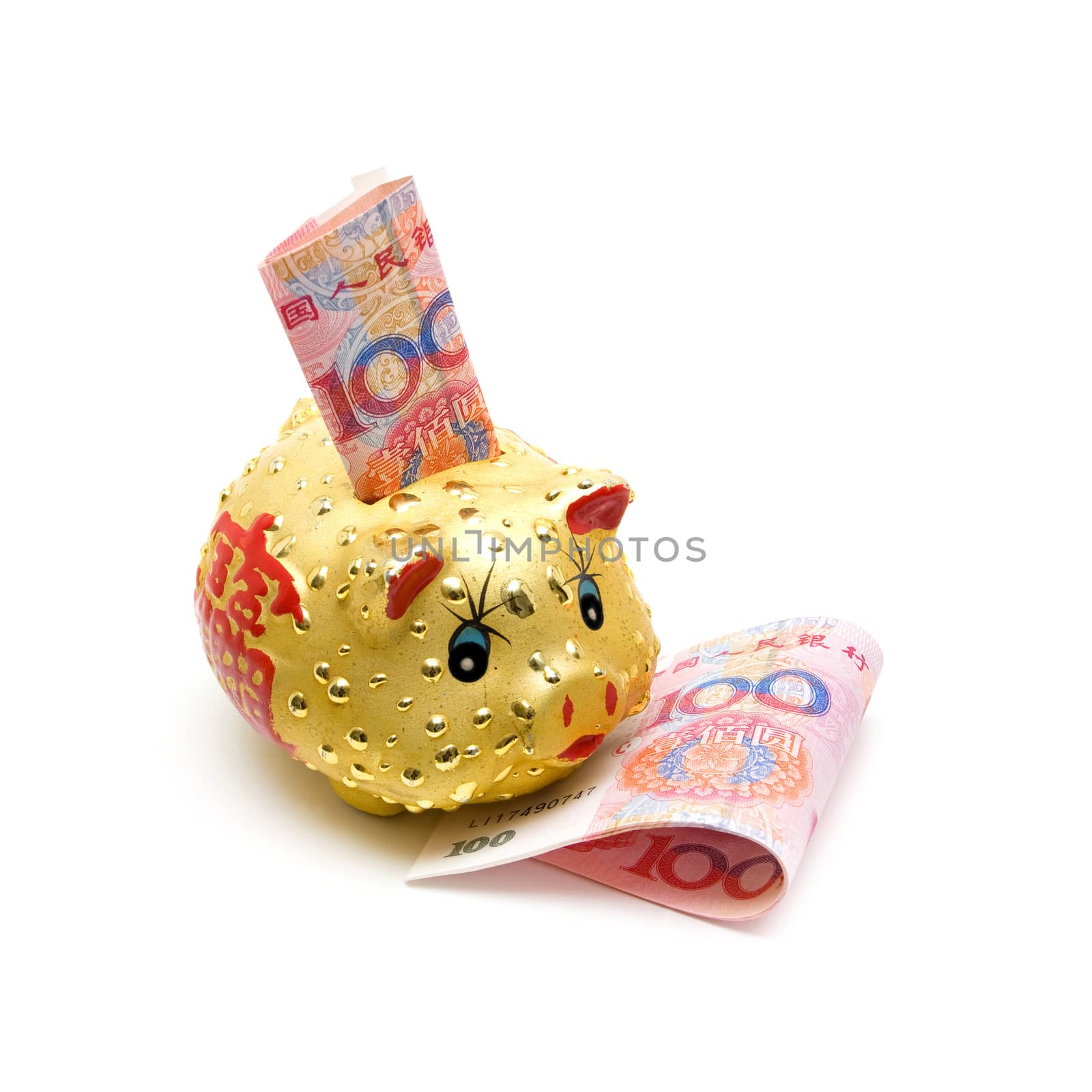 Piggy bank and Chinese yuan note isolated on white background