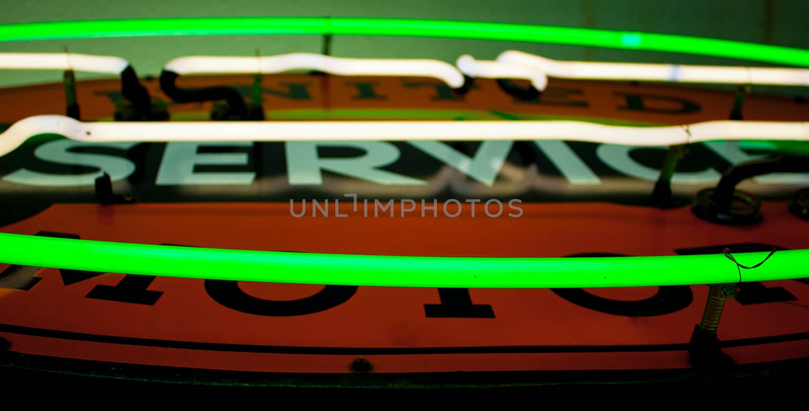 Close up of a green and white neon tubes on a sign by experiencesnw