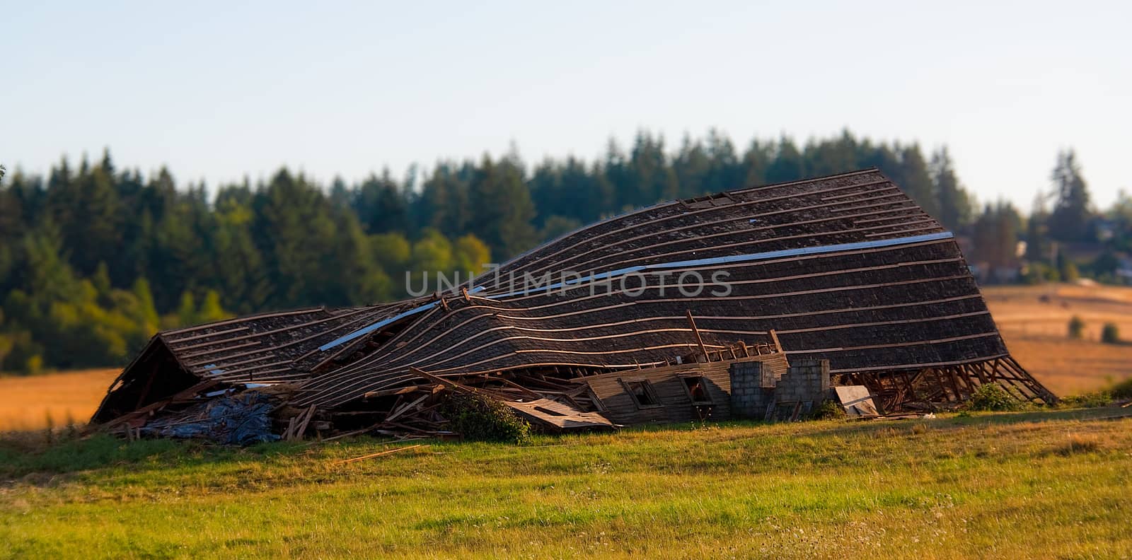 Collapsed abandoned old wooden barn by experiencesnw