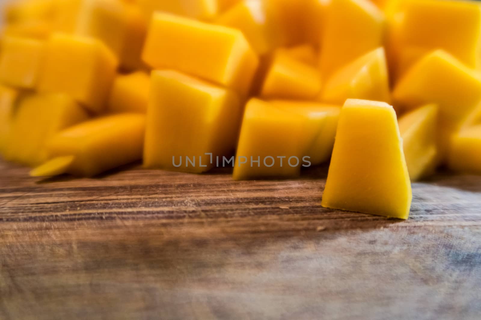 Butternut squash or mango chopped on wood by fpalaticky