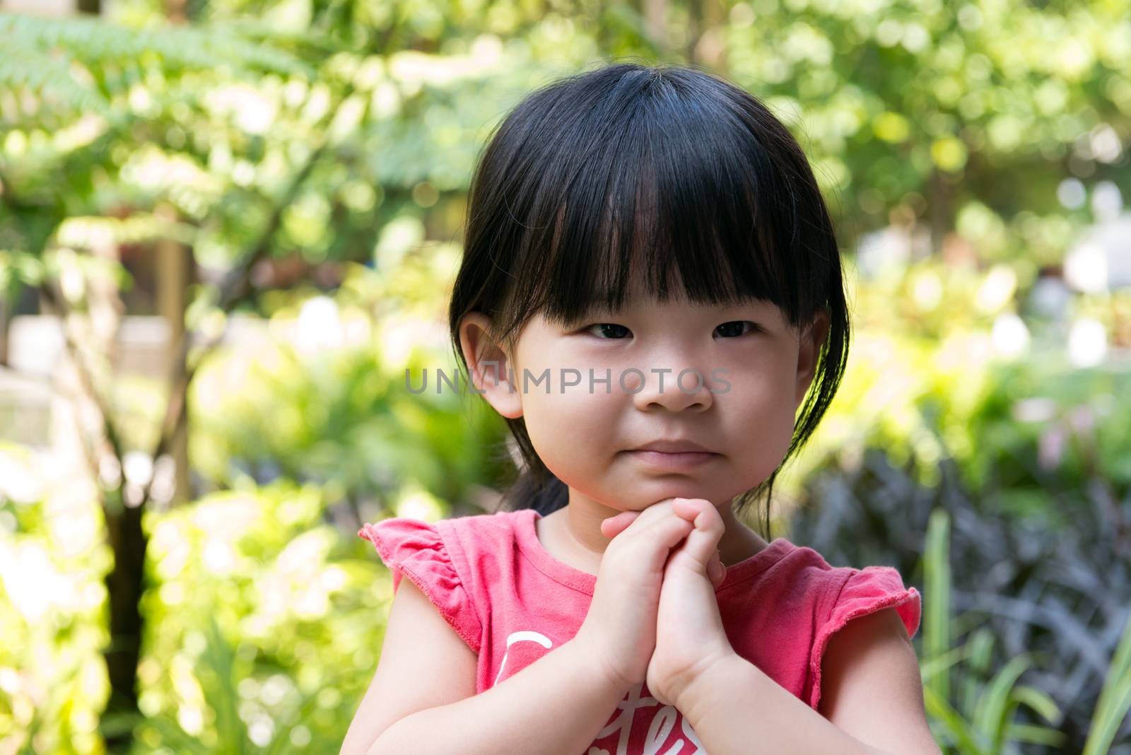 Portrait of beautiful asian child girl in outdoor park