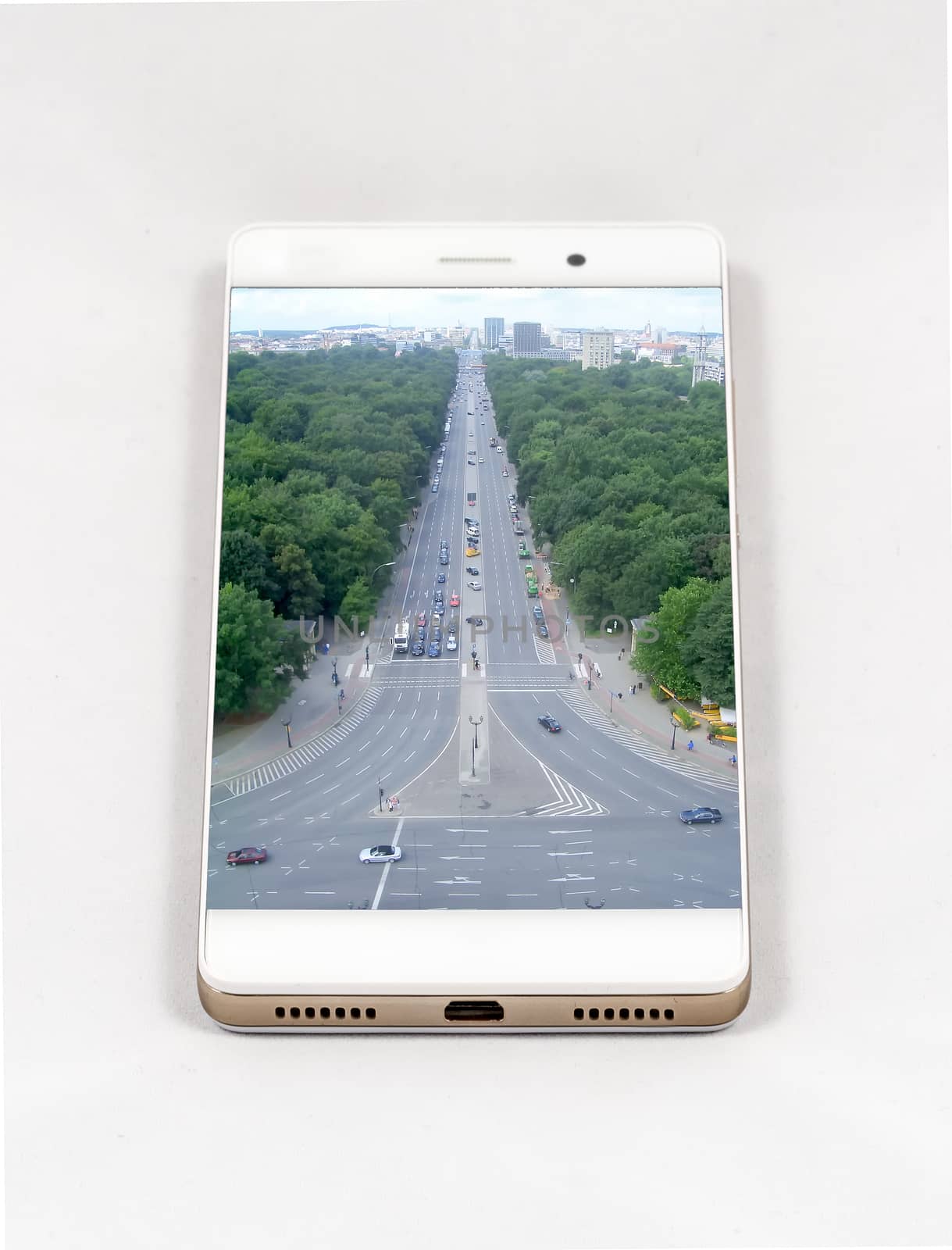 Modern smartphone with full screen picture of Berlin, Germany. Concept for travel smartphone photography. All images in this composition are made by me and separately available on my portfolio