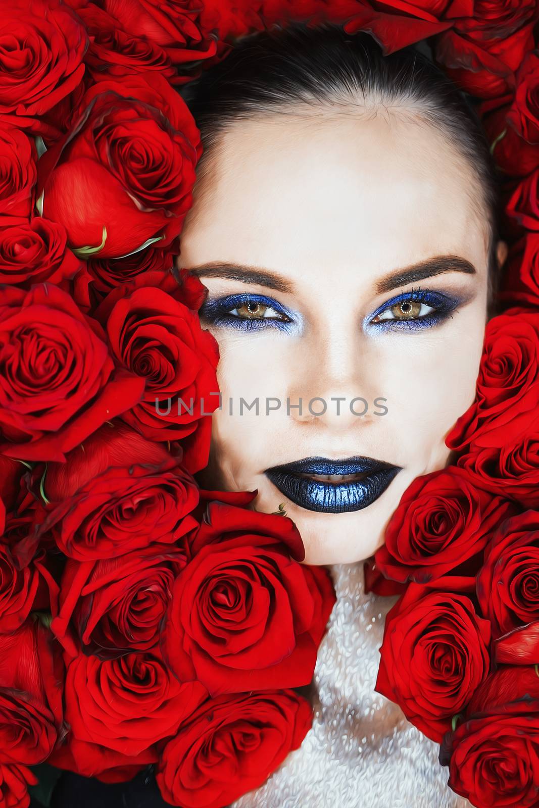Beautiful Woman's Face and rose petals.Perfect Skin.