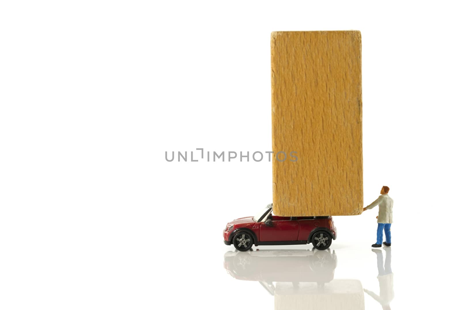 little figure man transport wooden block by compuinfoto