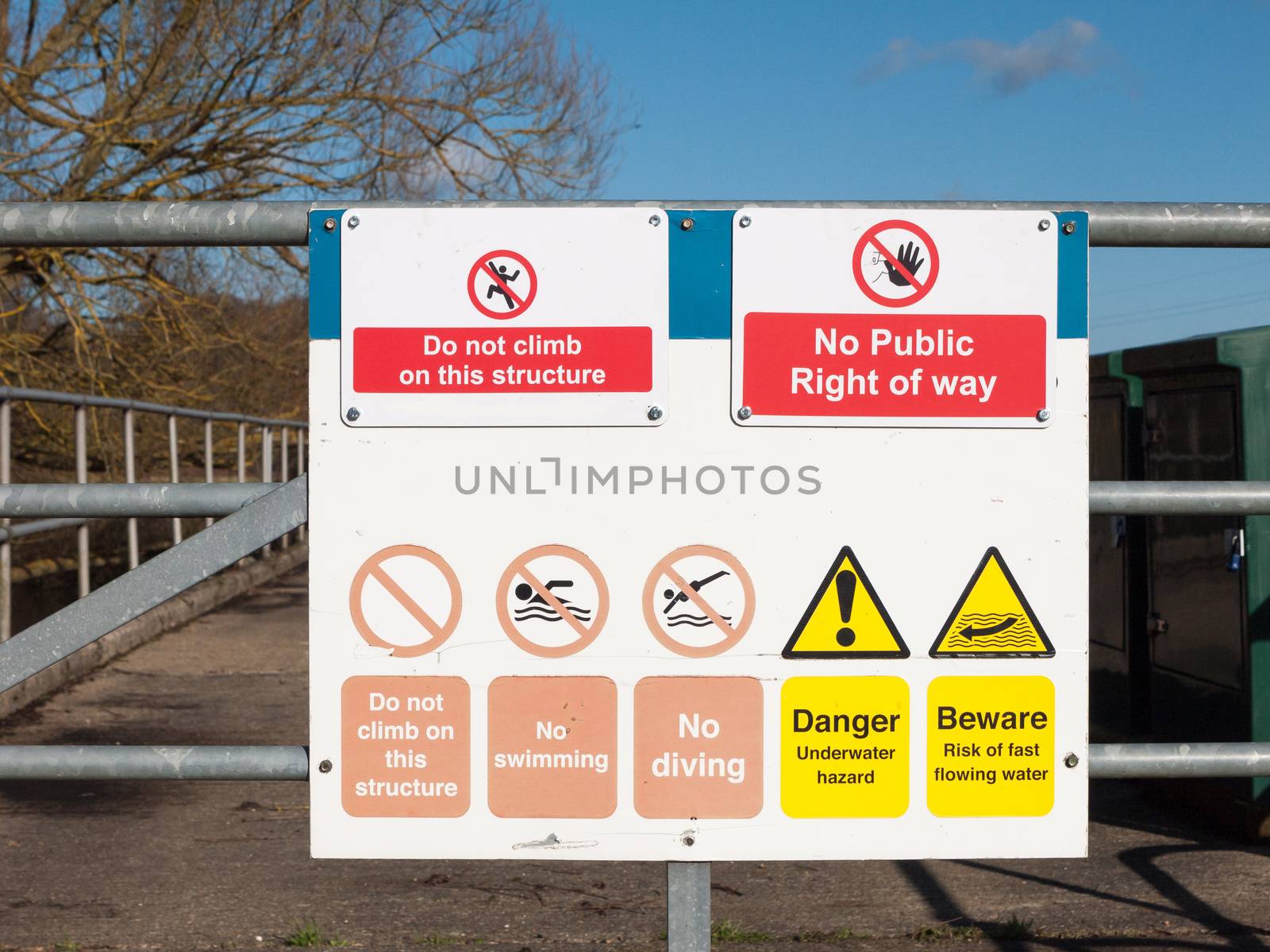 safety nature sign on locked metal gate do not climb this structure no public right of way warning; essex; england; uk