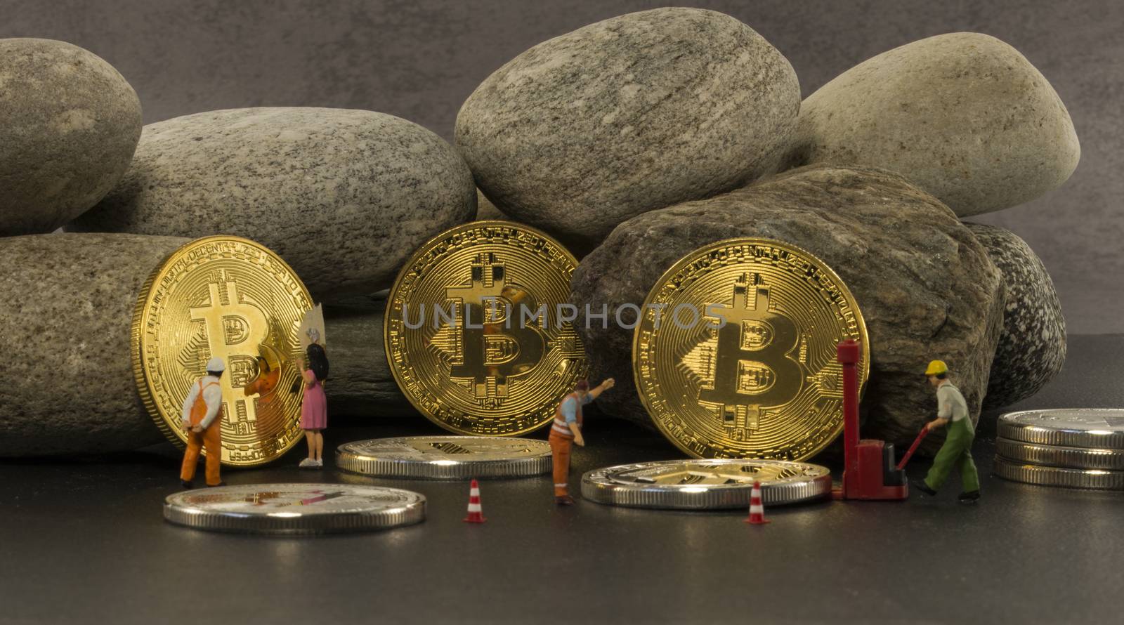 little figures putting the bitcoins in a saf solid as a rock