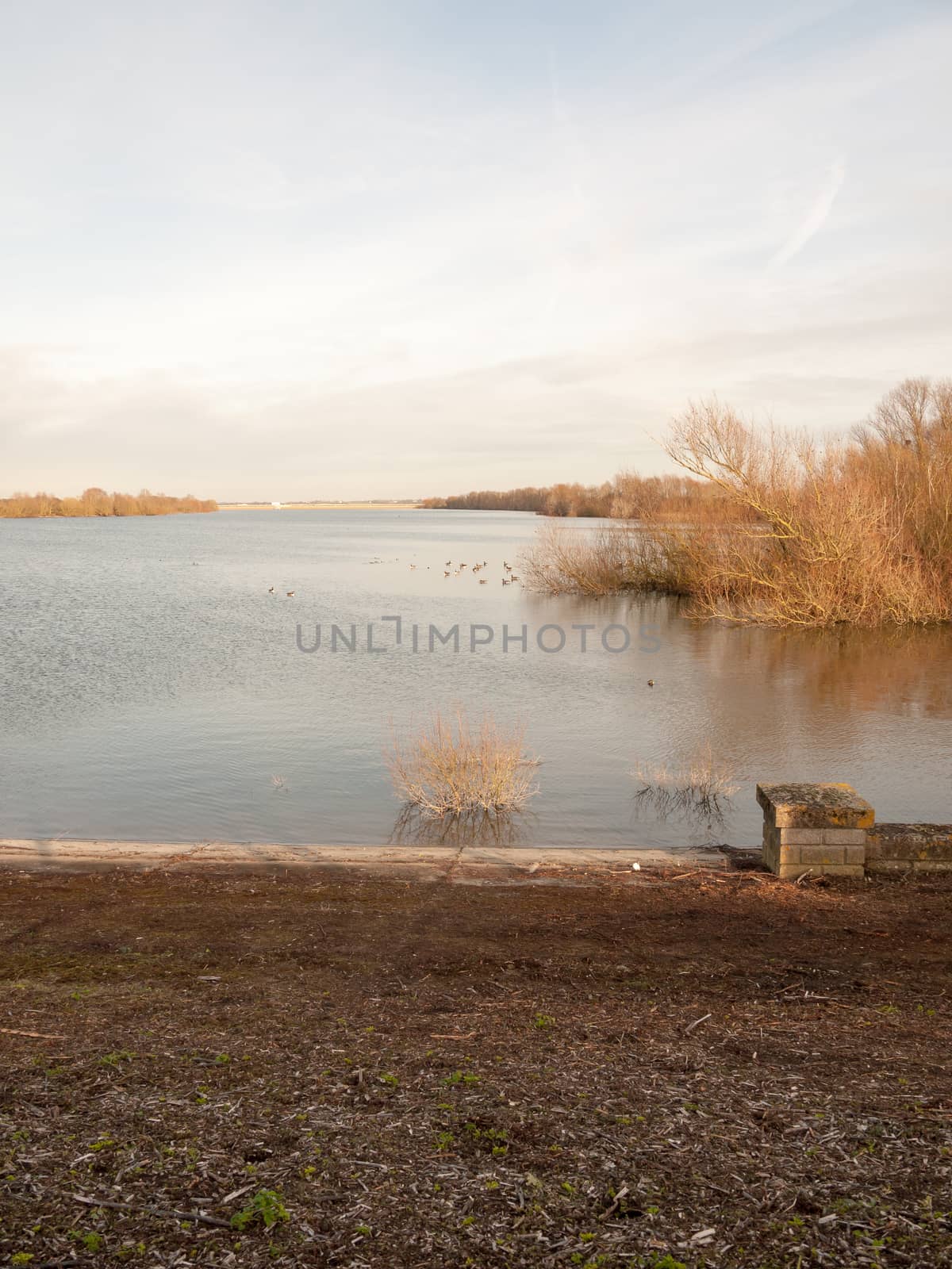 coast flat water surface reservoir scene dam in distance; essex; england; uk