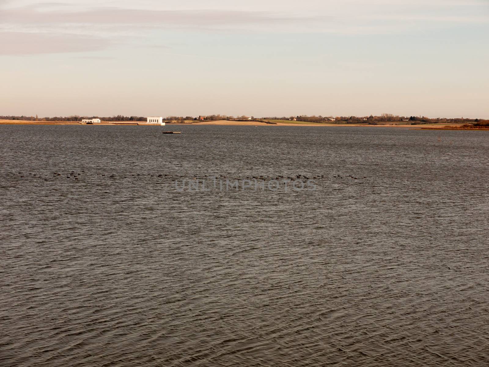 open bay of water surface sea ripple summer spring landscape horizon; essex; england; uk