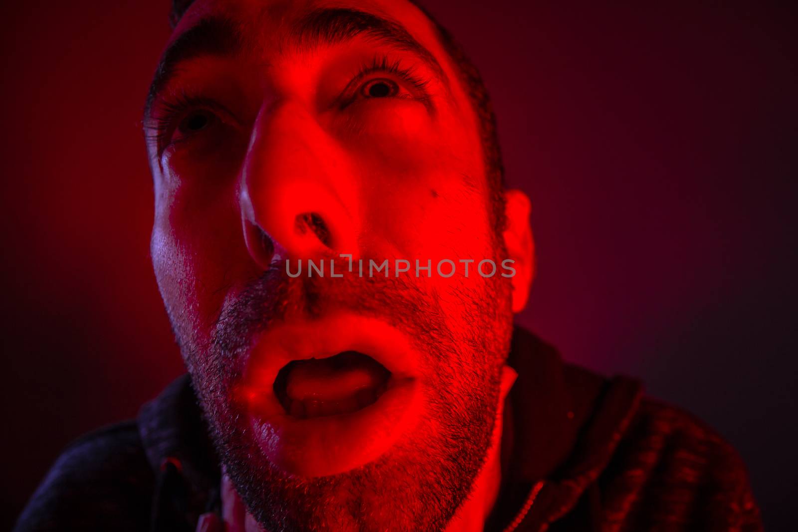 Depressed stressed man strangling himself. Close up headshot portrait of man chokes