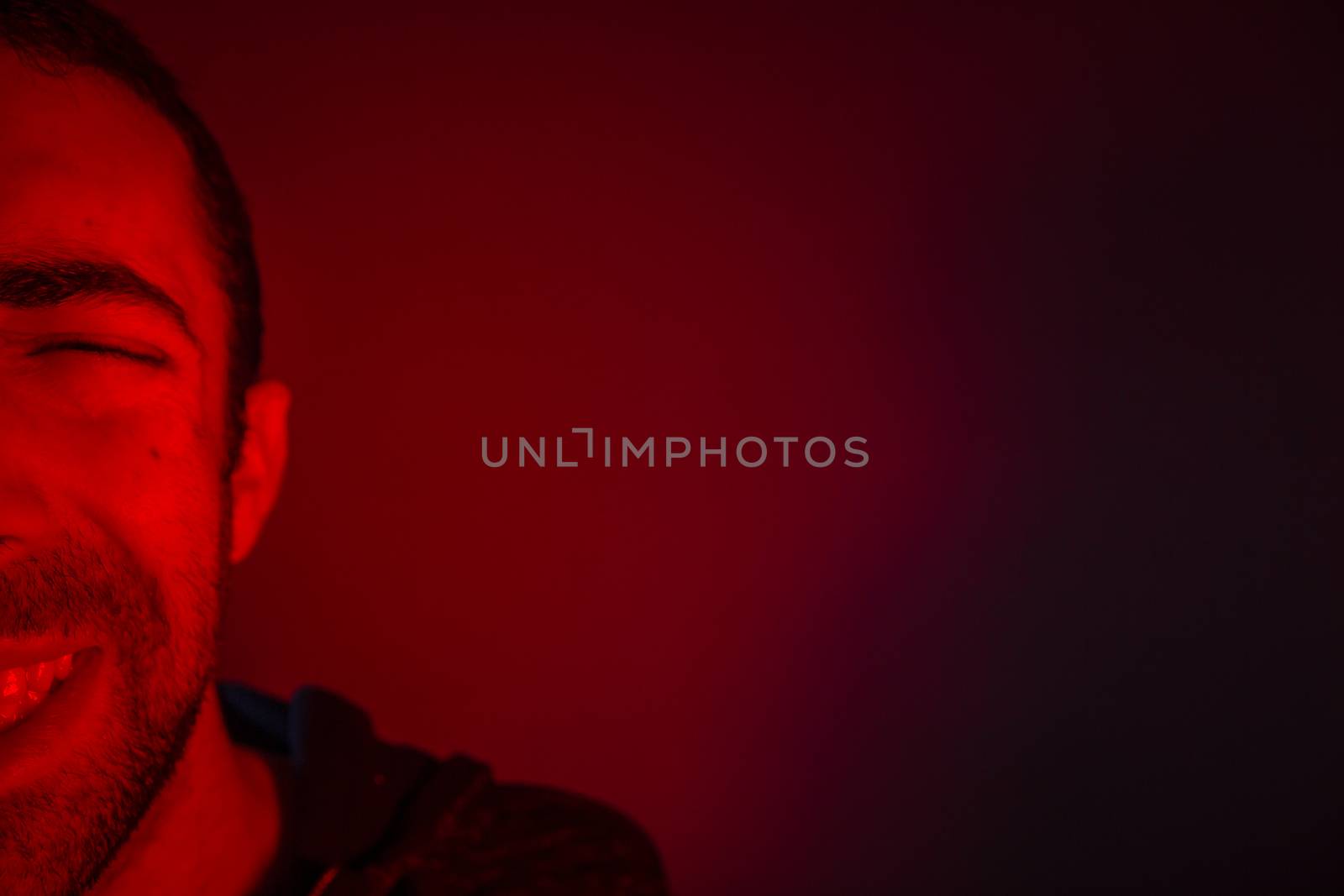 Man is suffering from pain or grief. Close up headshot portrait of man feeling upset or in pain.