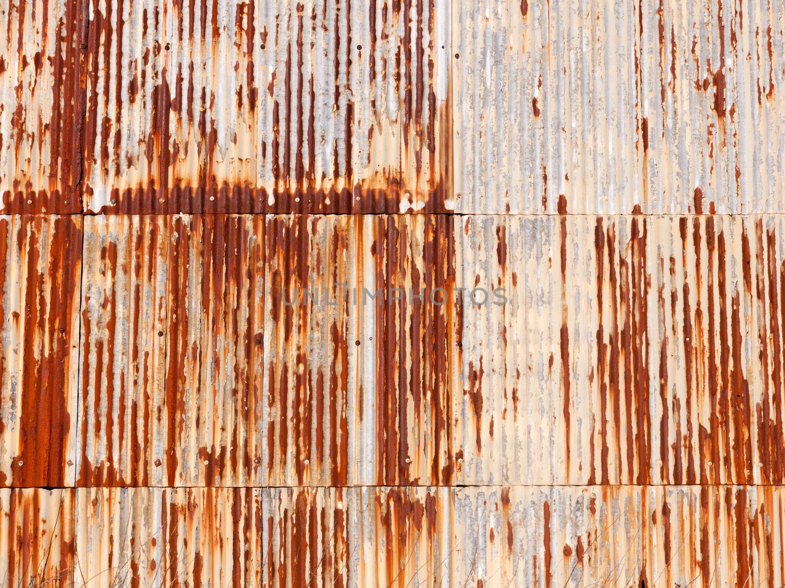 brown rusty dirty old retro metal corrugated iron shed background grunge industry; essex; england; uk