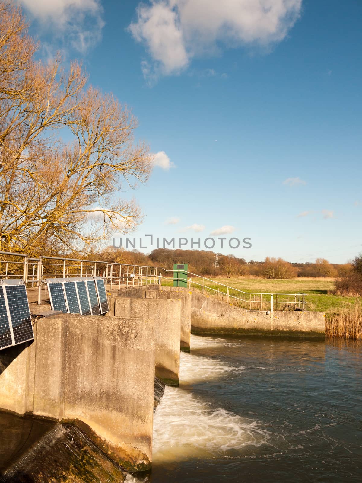 side view of river water damn bridge sluice outside country; essex; england; uk