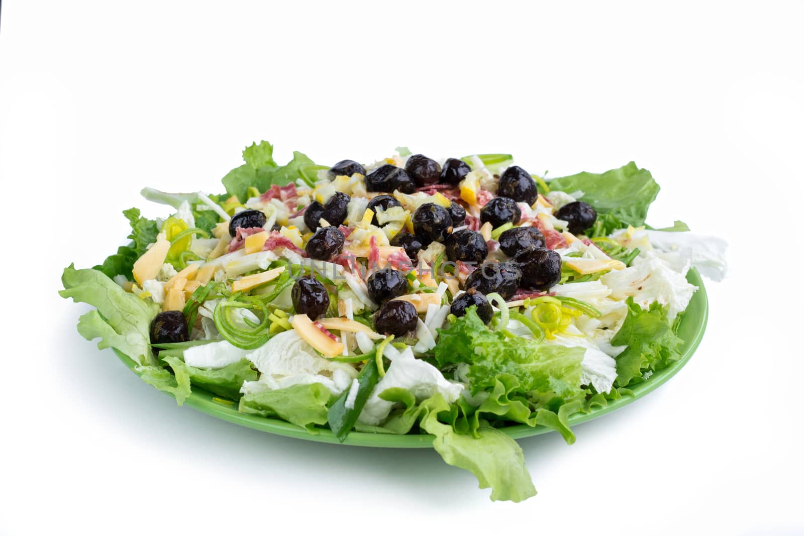 Green fresh salad with vegetables, olives, cabbage, onions, sausages for healthy fitness slim diet, isolated still life