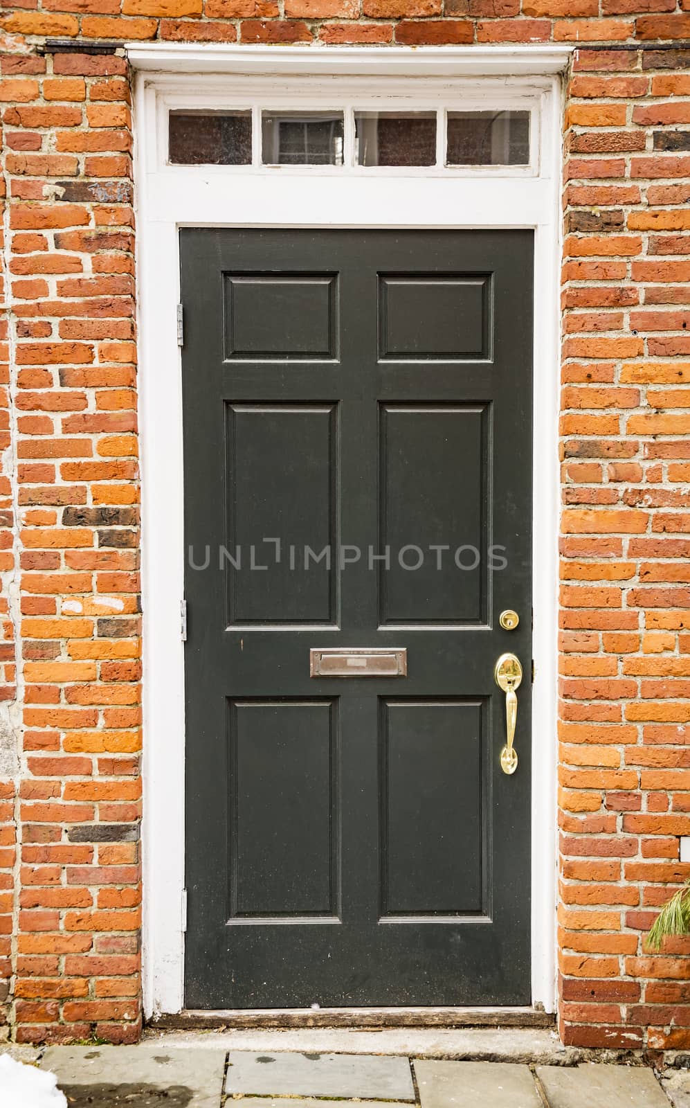 Door of a typical New England residential house with small entrance garden