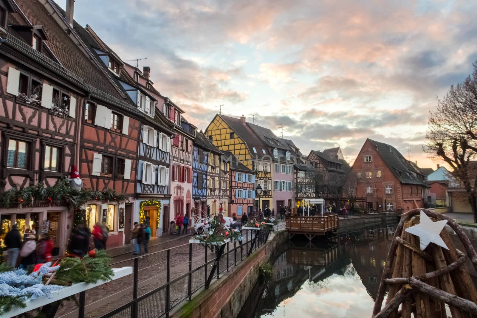 View from a bridge of the Petite Venise part of Colmar with beautiful and typical architecture. During christmas period with at sunset.