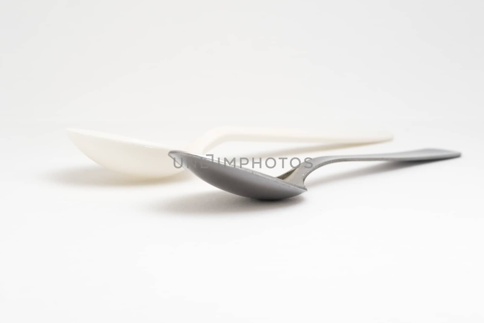 Recycling, Metal and plastic spoon opposition by fpalaticky