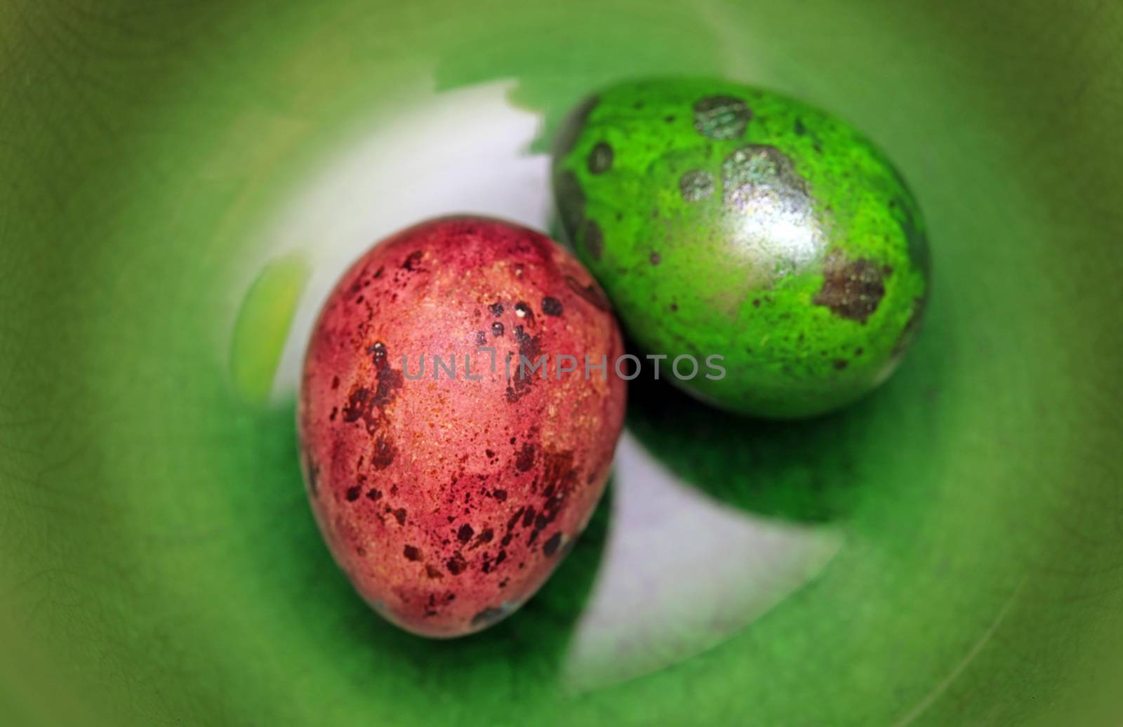 Colorful Speckled Easter Egg on Green Background